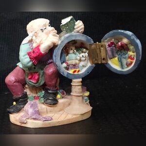 Santa Claus Figurine with Globe that Opens to a Surprise